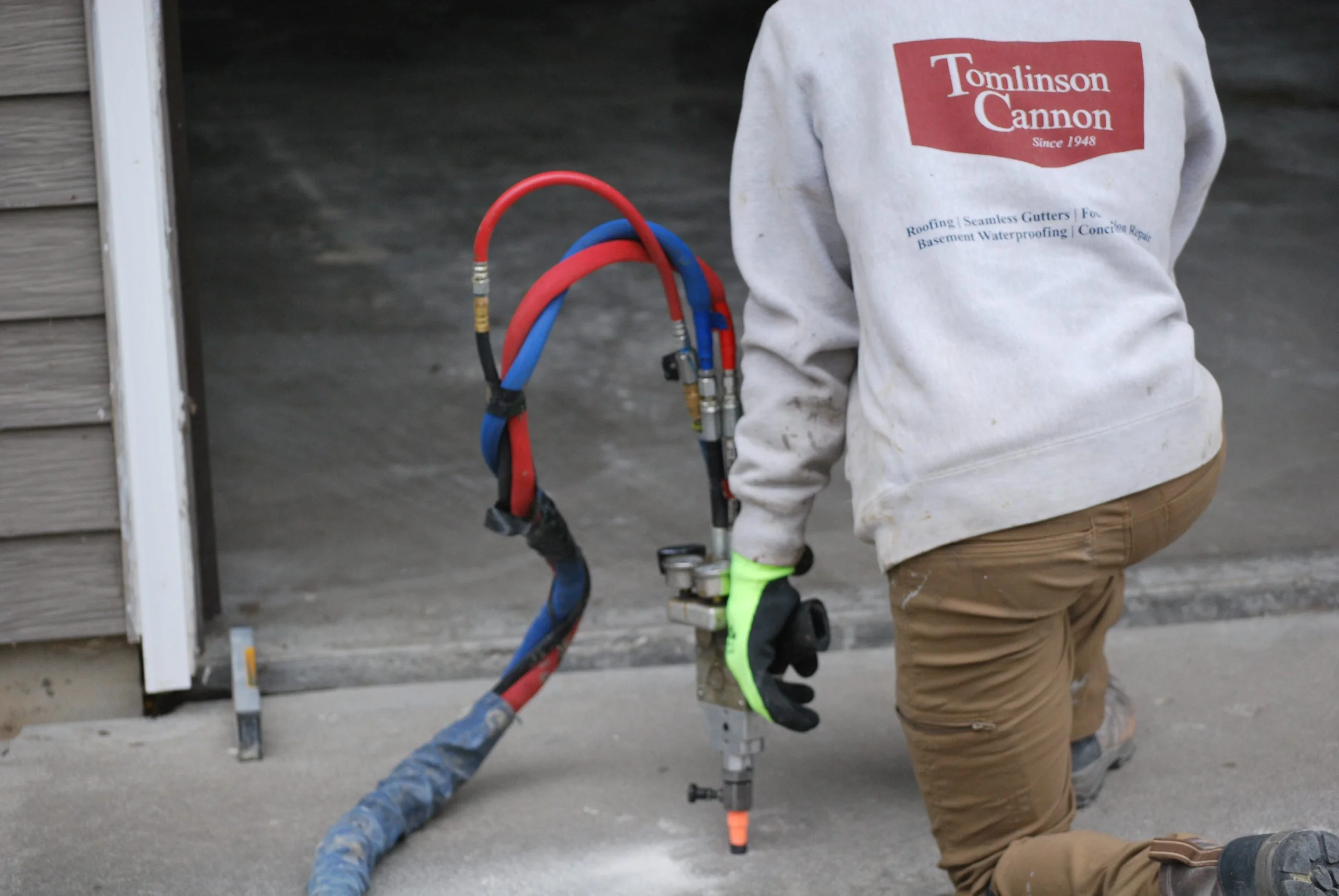 Tomlinson Cannon team leveling concrete in a home in Iowa